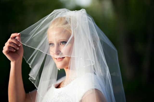 If a woman broke the Law of Chastity, can she still wear a veil during a marriage ceremony?