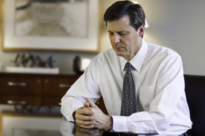 A Man at a Desk in Prayer | Being Excommunication From LDS Church for Adultery