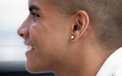 As members of the Church, what can I do to encourage my husband to give up the notion of wearing earrings?