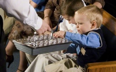 What is the correct posture or stance for passing the Sacrament?
