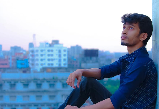 Man Sitting on a Window Sill with a View of a City | Can You Commit Adultery in Your Mind? | Is Adultery by Thought a Sin?
