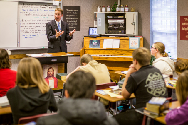 Why does the Church pay seminary and institute teachers?