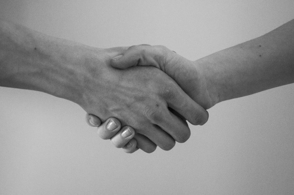 How can I best explain that the handshake in the temples aren’t cultish or bad?